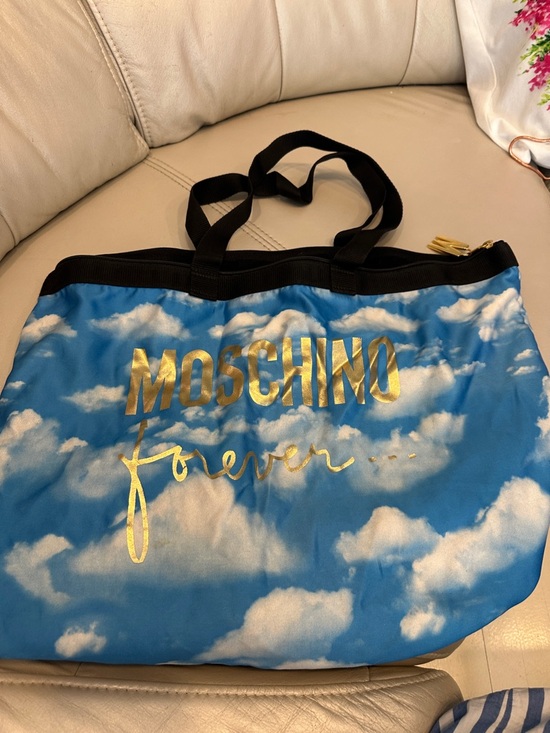 Moschino Handbags - Moschino Blue Cloud Print Tote with Gold Logo and Black Handles
